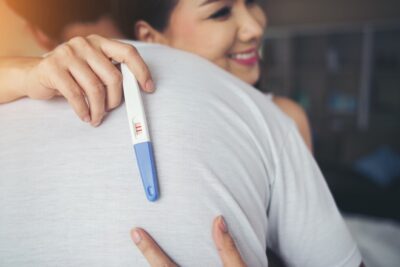 Fertility happy-couple-smiling-after-find-out-positive-pregnancy-test