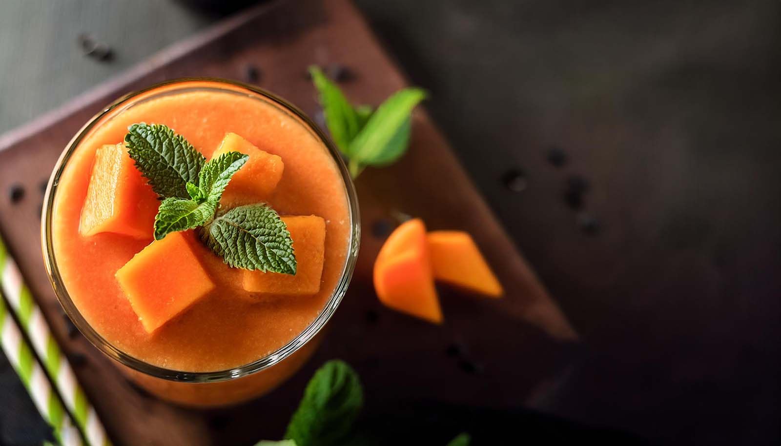 Smoothie with Papaya and mint on top; healthy food, diet, fitness menu