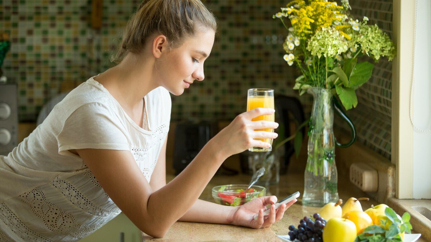 portrait attractive woman with juice phone 1163 2006 e1726856702660