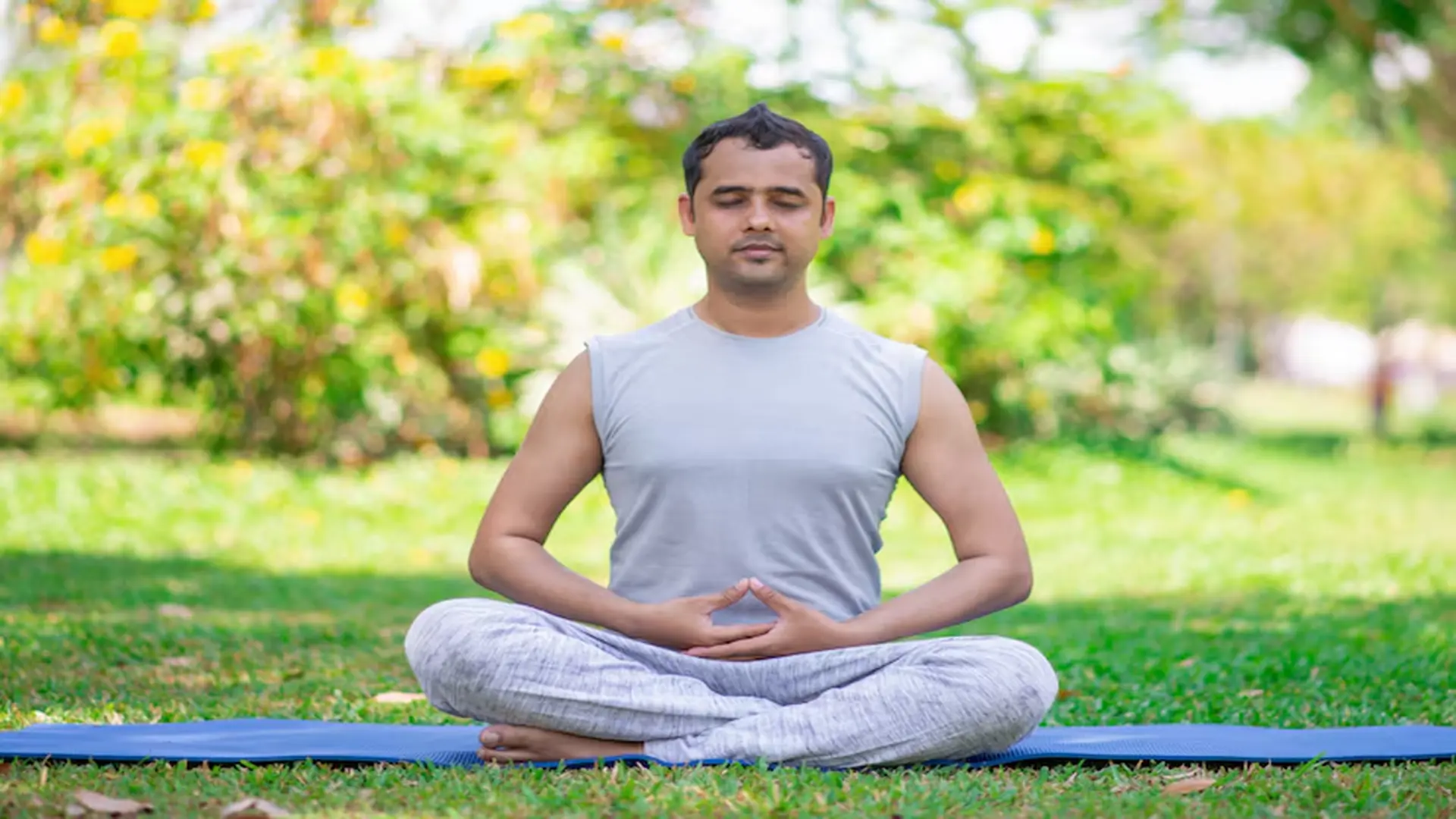 focused young indian man meditating lotus pose 1262 12658